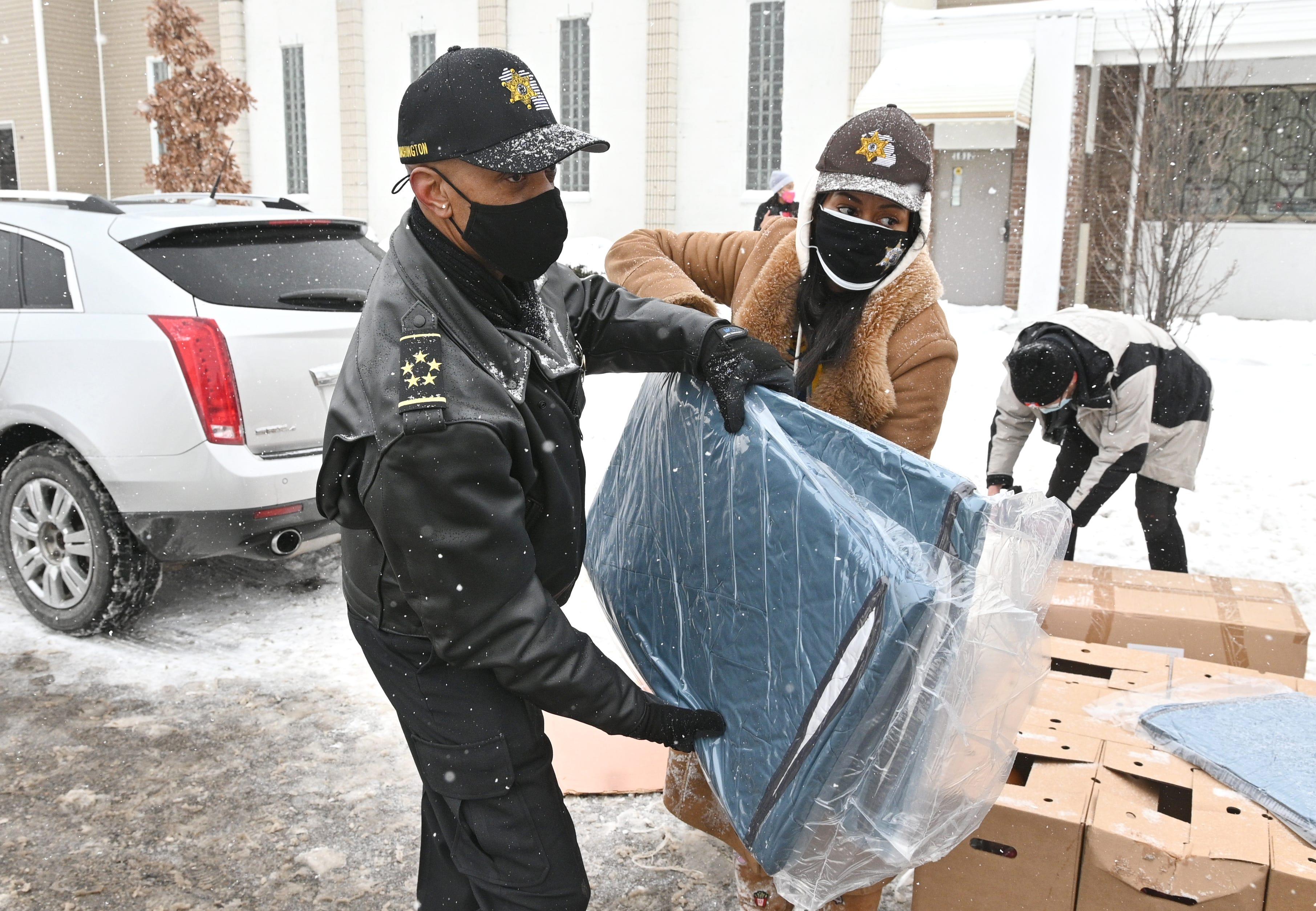 Wayne County Sheriff Raphael Washington, left, and Regina Parks, director...