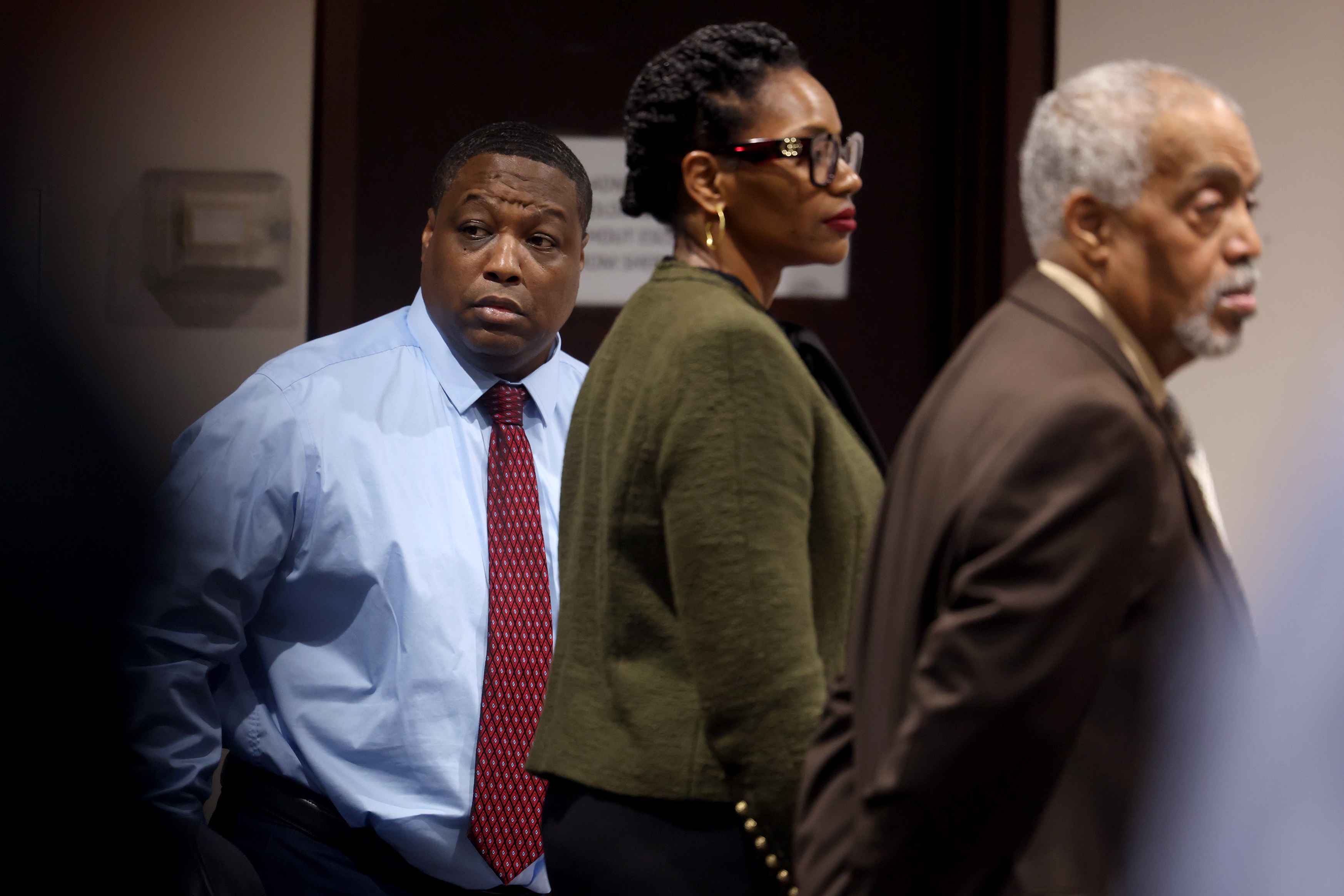 Earl Wilson, left, stands ahead of openings in his jury...